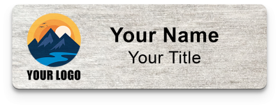 Real wood eco name badge with laser-etched name and grain visible in the surface